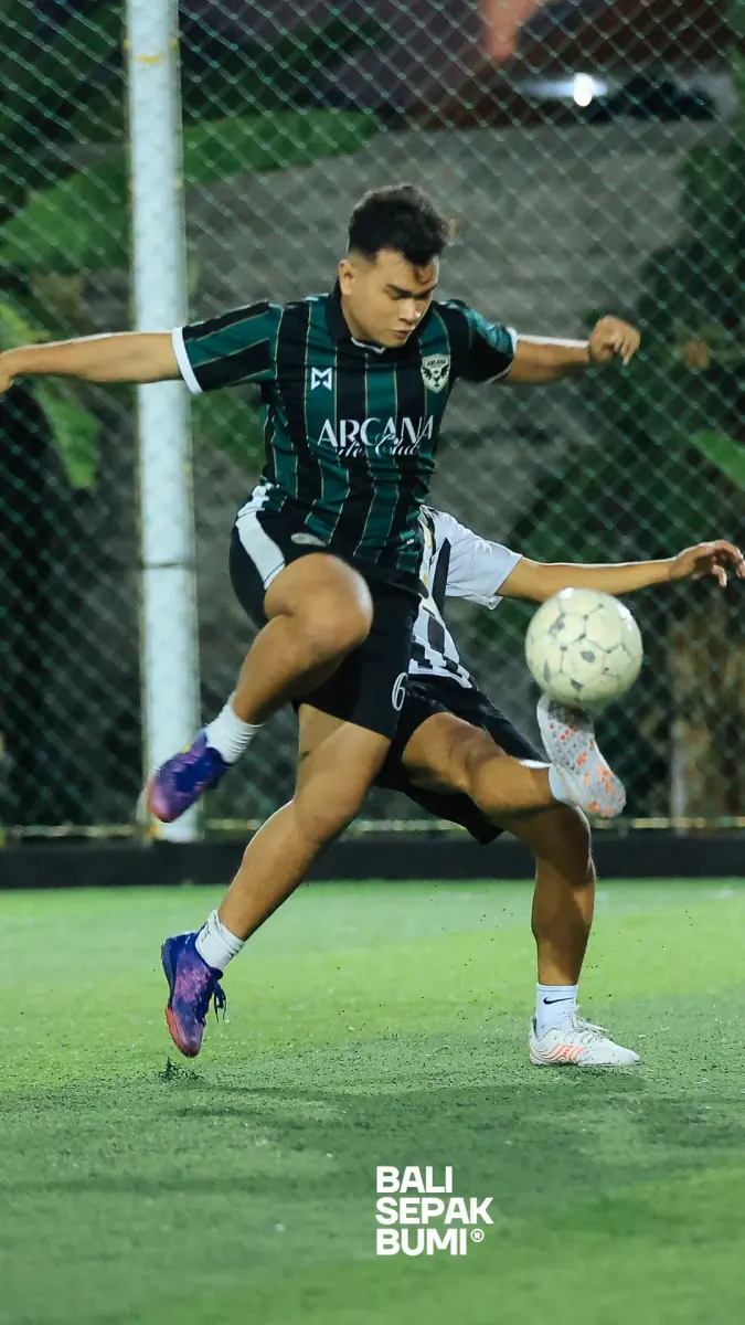 Playing five-a-side football on a floodlit pitch